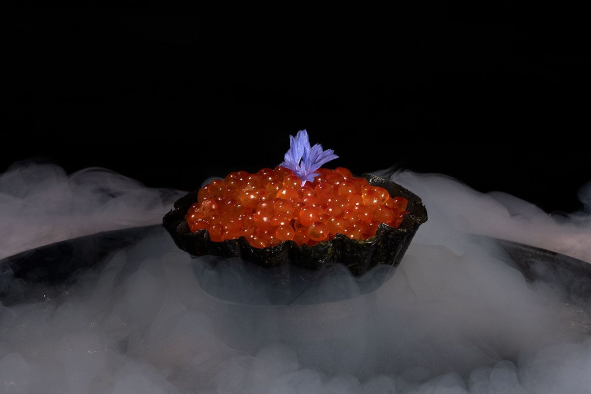 A bowl of food with surrounding smoke